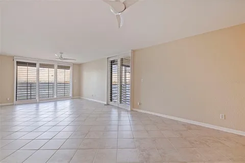 a view of empty room with windows