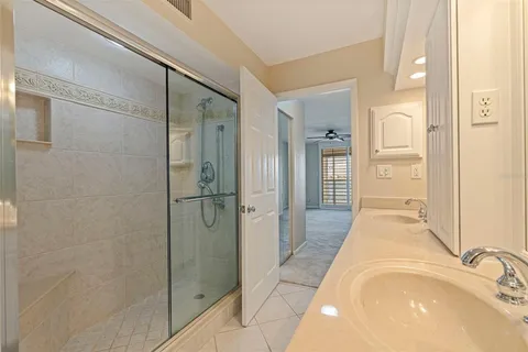 a view of a livingroom with a ceiling fan and window