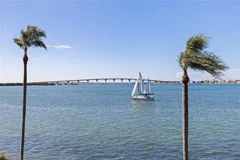 a kitchen with stainless steel appliances granite countertop a sink and a window