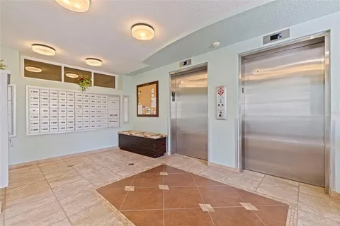 an aerial view of a house with a lake view
