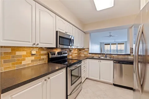 a view of a kitchen with a sink