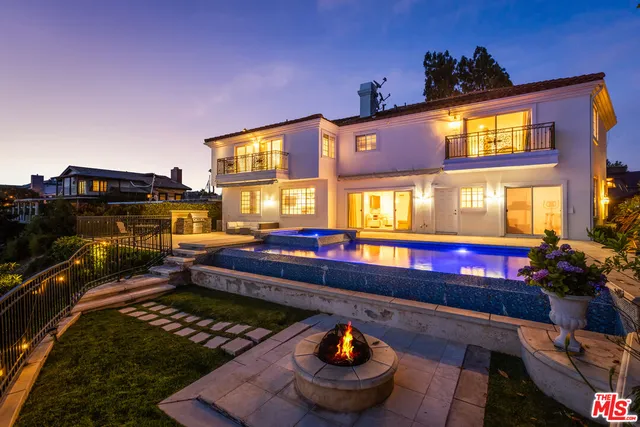 a view of a pool with a patio