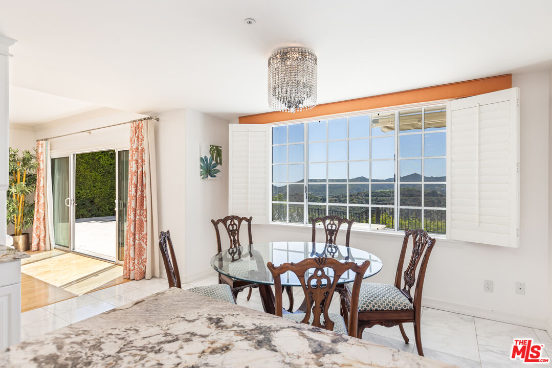 1957 Linda Flora Drive Los Angeles, CA 90077 - Photo 13 of 48 a view of a dining room with furniture window and outside view