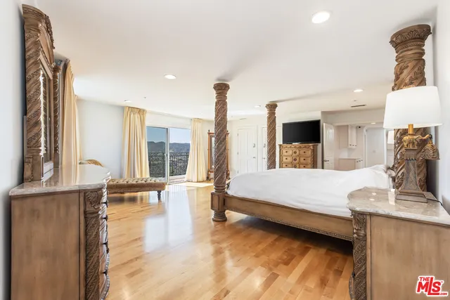 a bathroom with a double vanity sink mirror and shower