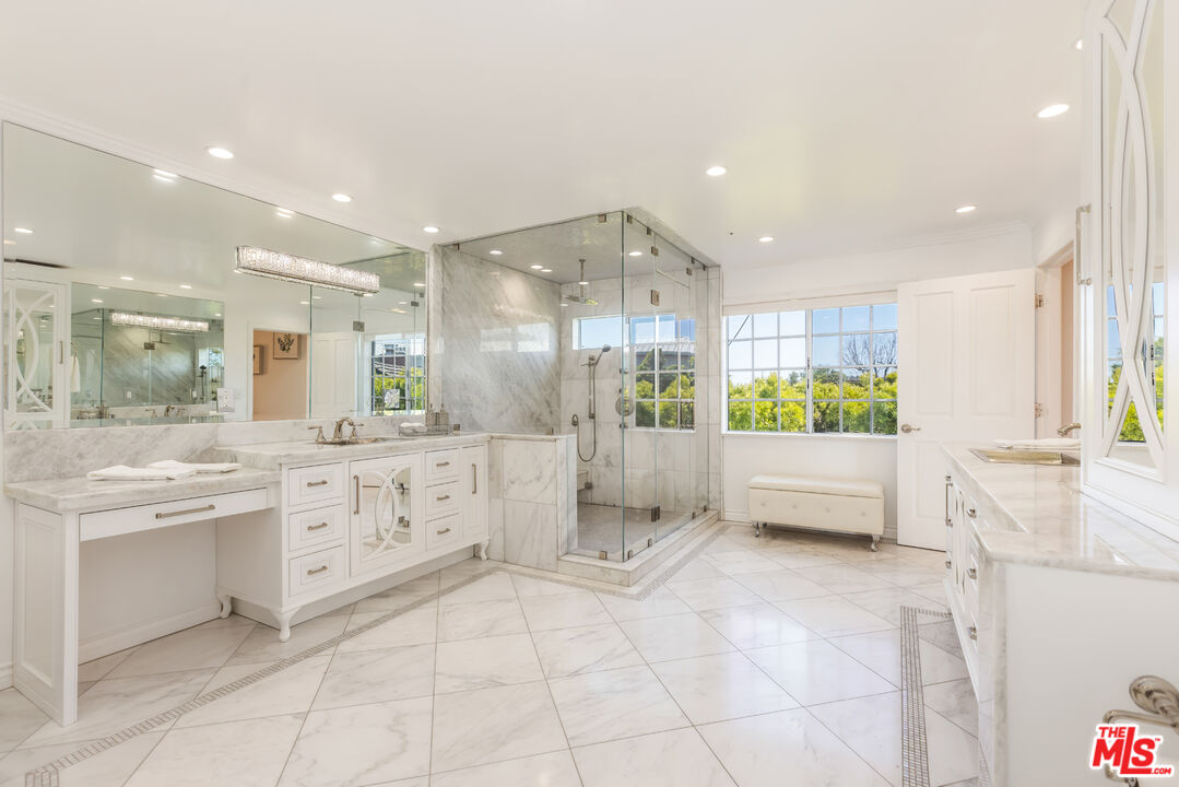 1957 Linda Flora Drive Los Angeles, CA 90077 - Photo 21 of 48 a large bathroom with a large tub and sink