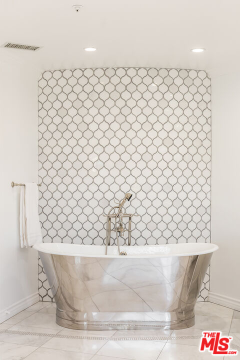 1957 Linda Flora Drive Los Angeles, CA 90077 - Photo 24 of 48 a white bath tub sitting next to a white wall