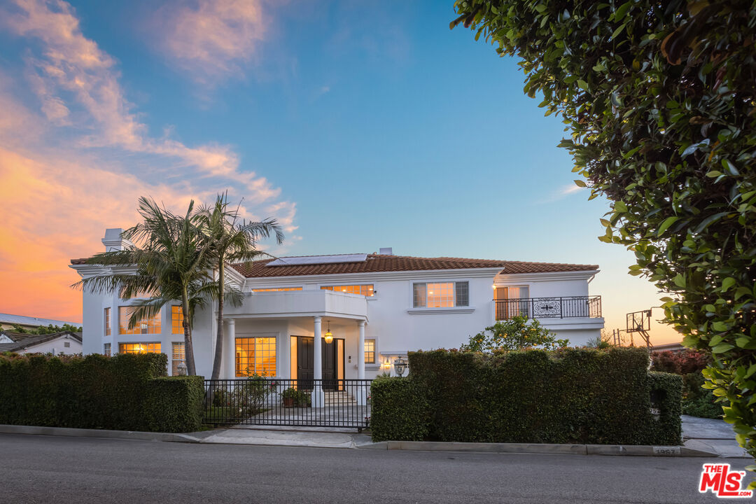 1957 Linda Flora Drive Los Angeles, CA 90077 - Photo 3 of 48 a front view of a house with garden
