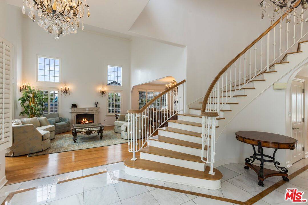 1957 Linda Flora Drive Los Angeles, CA 90077 - Photo 5 of 48 a view of hall way with furniture and a chandelier