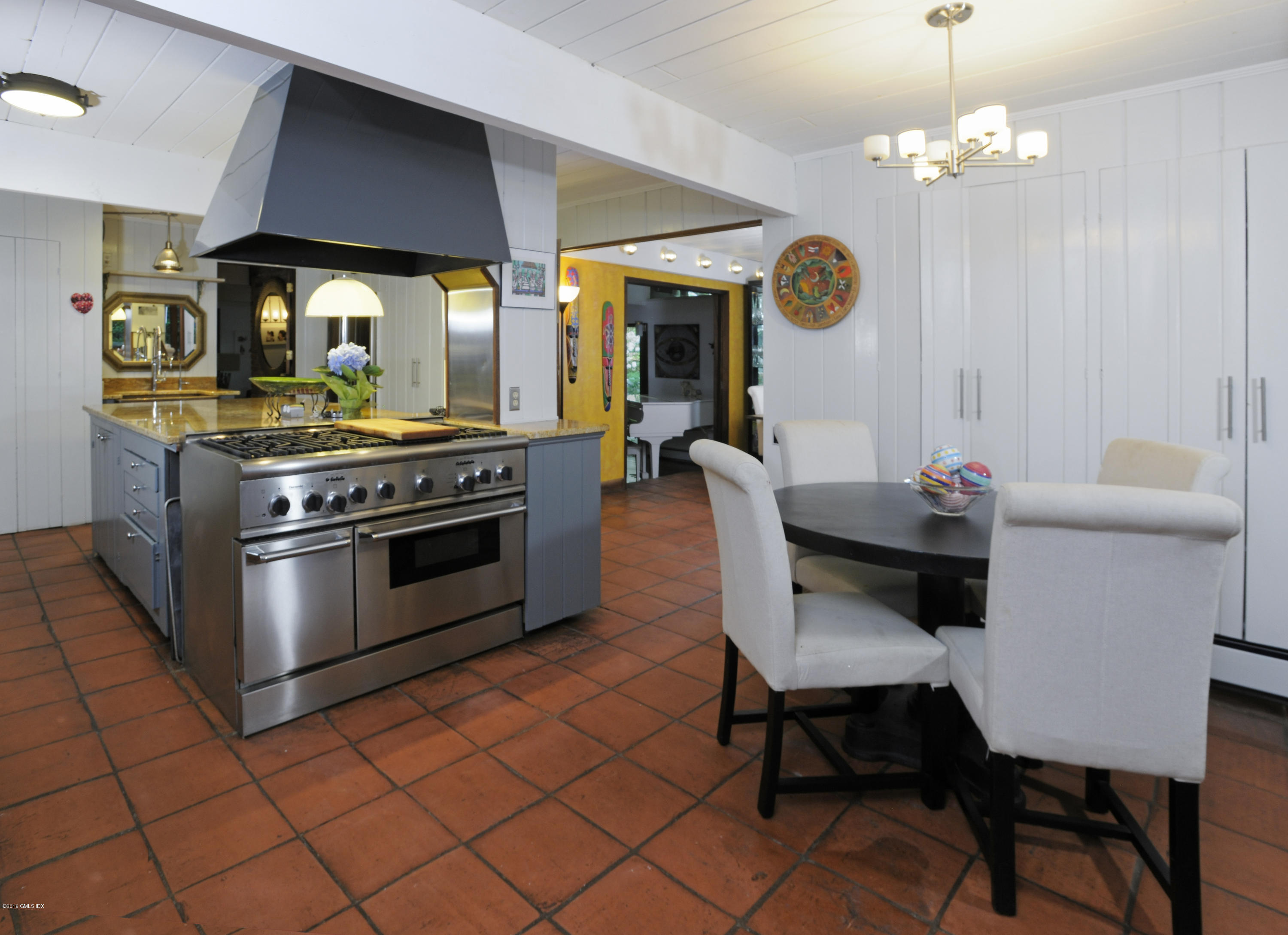 18 Ferncliff Road Cos Cob, CT 06807 - Photo 11 of 24 a kitchen with a stove a table and chairs