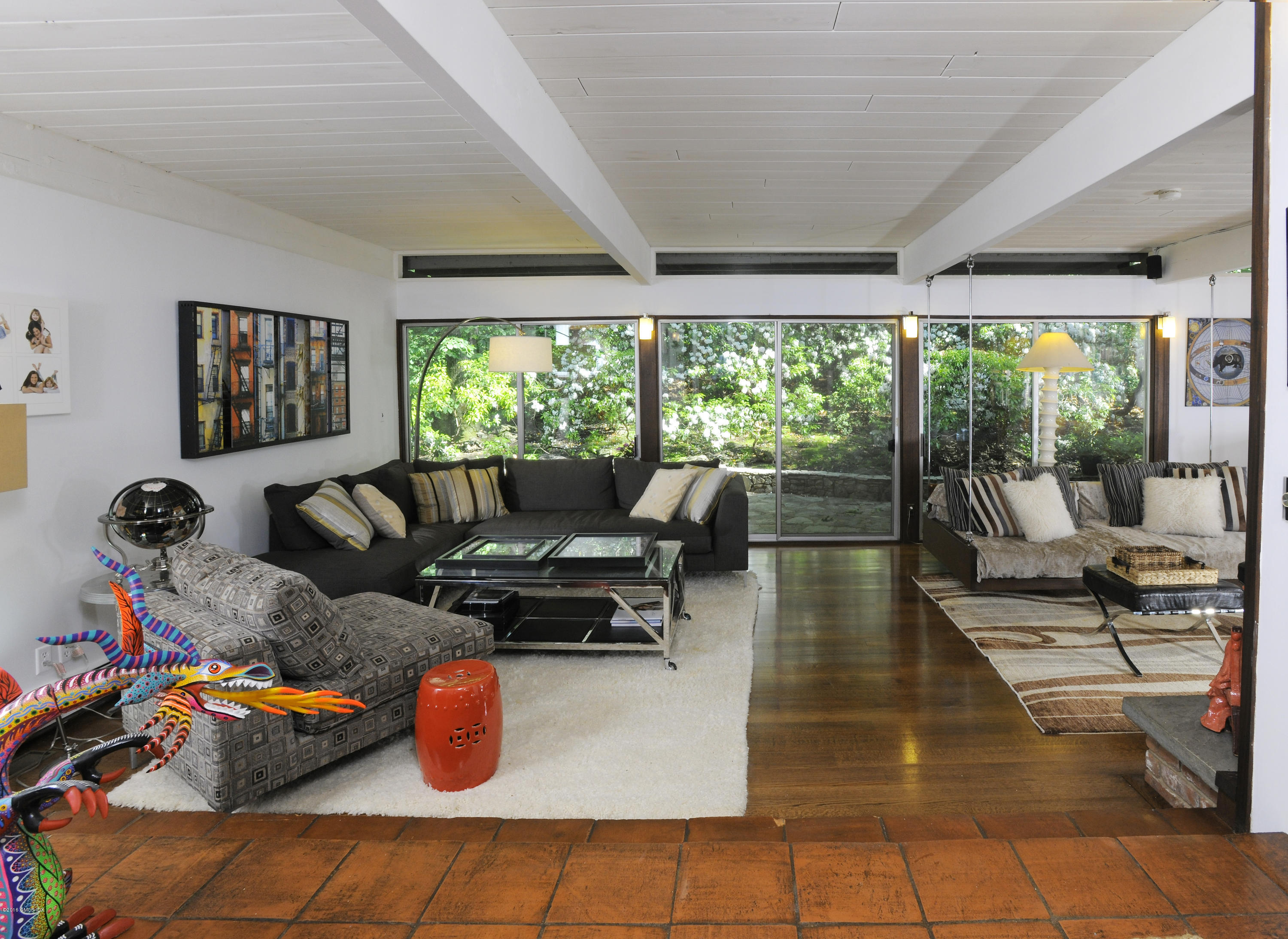 18 Ferncliff Road Cos Cob, CT 06807 - Photo 4 of 24 a living room with furniture a fireplace and large windows