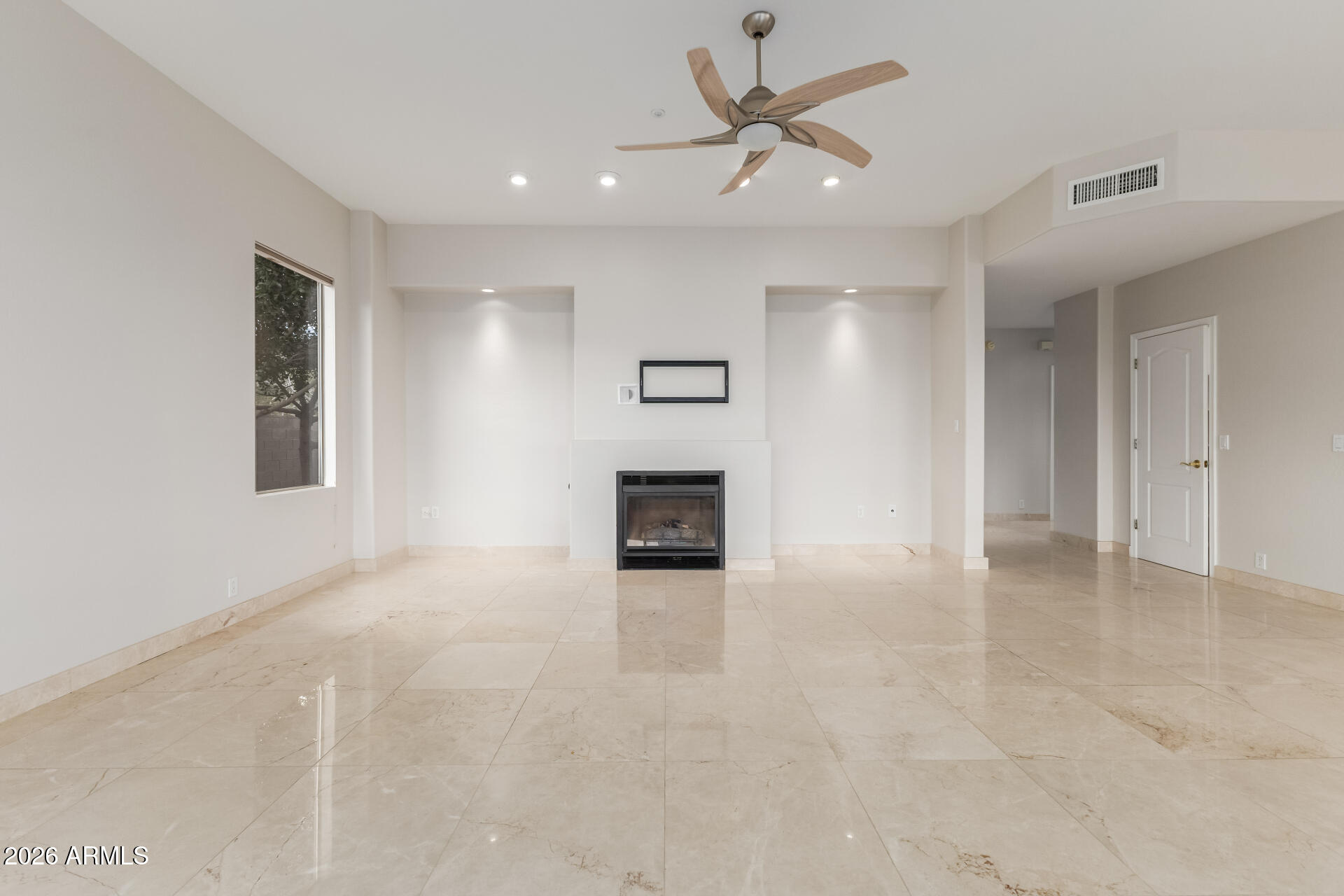 10872 East Raintree Drive Scottsdale, AZ 85255 - Photo 14 of 54 a view of a hallway with a kitchen