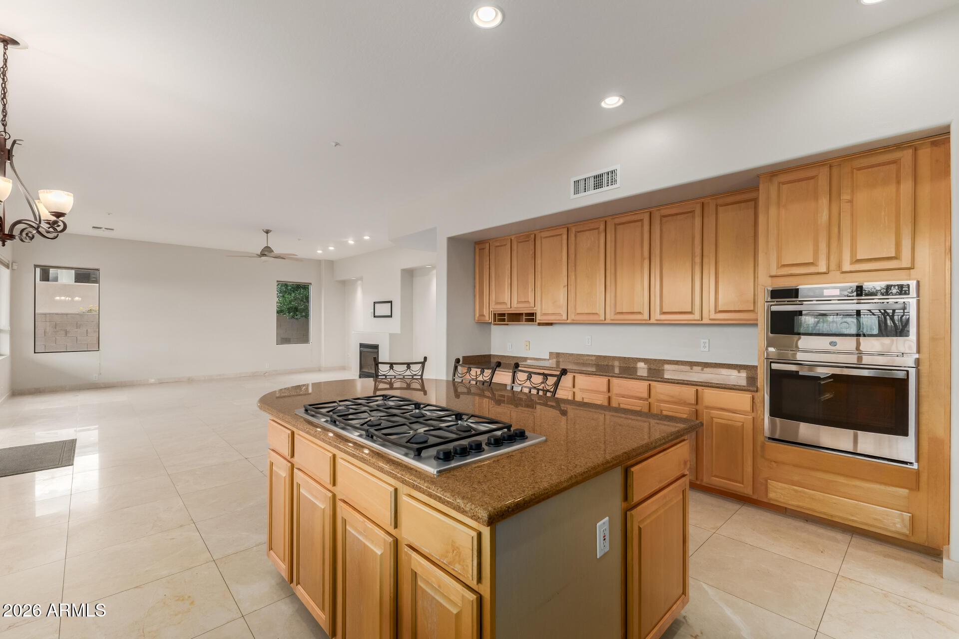 10872 East Raintree Drive Scottsdale, AZ 85255 - Photo 19 of 54 a kitchen with a stove a sink and a refrigerator