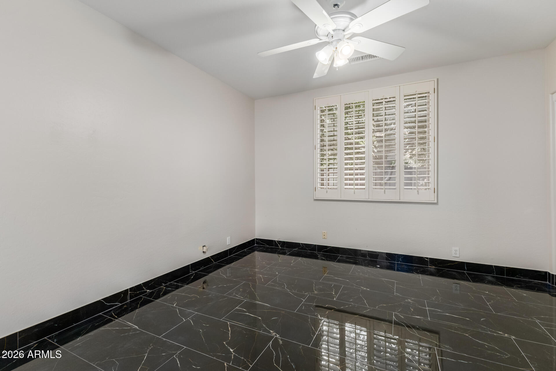 10872 East Raintree Drive Scottsdale, AZ 85255 - Photo 21 of 54 a view of an empty room with a window