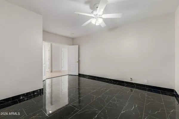 a bathroom with a toilet a sink a vanity and mirror