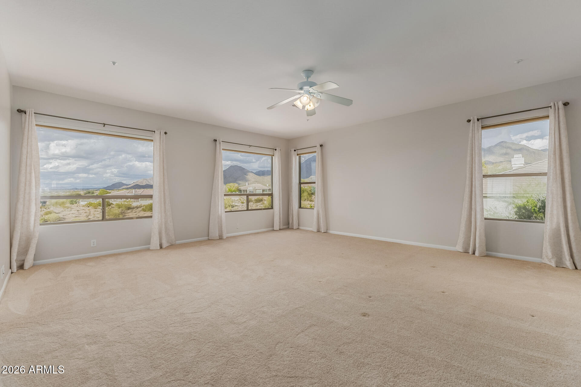10872 East Raintree Drive Scottsdale, AZ 85255 - Photo 26 of 54 an empty room with windows and closet
