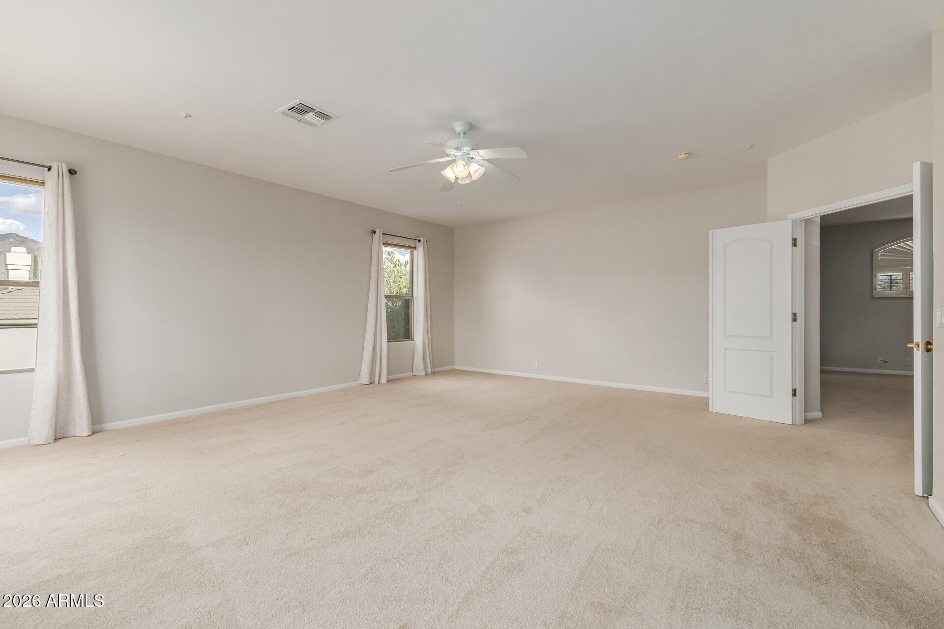 10872 East Raintree Drive Scottsdale, AZ 85255 - Photo 27 of 54 a view of an empty room with a window