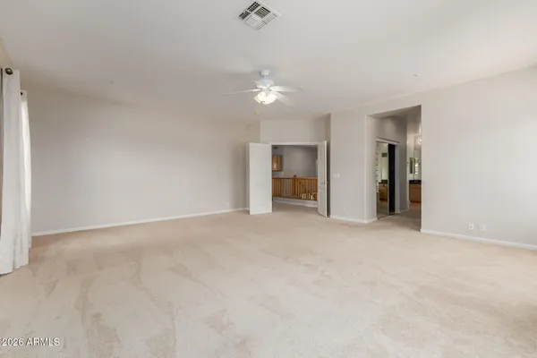 a bathroom with a granite countertop sink and a bathtub