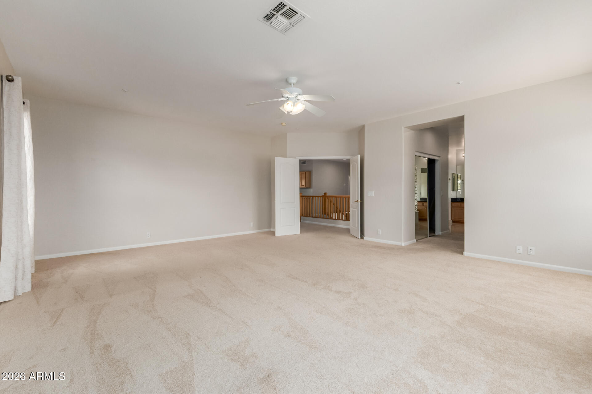 10872 East Raintree Drive Scottsdale, AZ 85255 - Photo 28 of 54 an empty room with an entryway and kitchen view