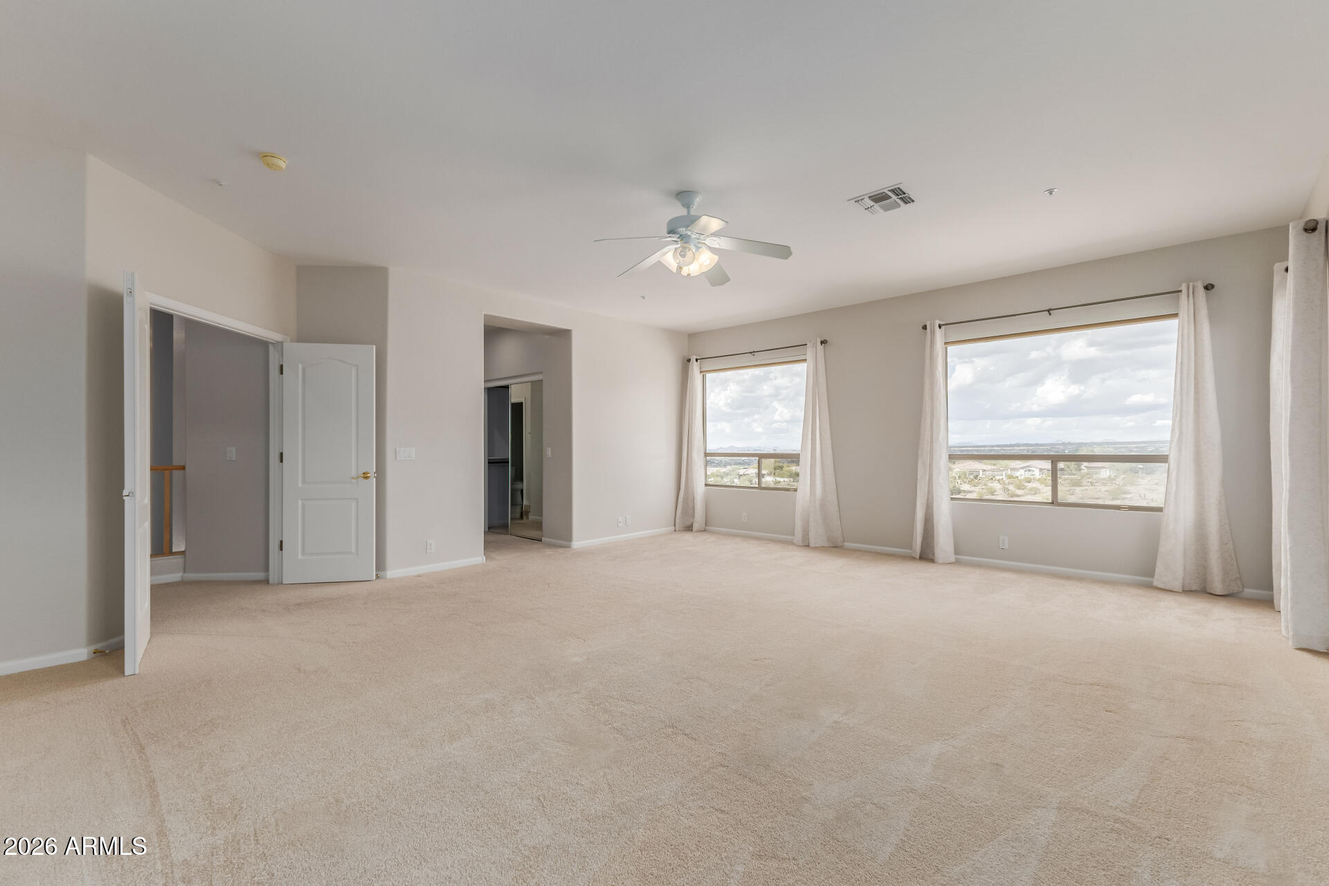 10872 East Raintree Drive Scottsdale, AZ 85255 - Photo 29 of 54 a view of an empty room with a window