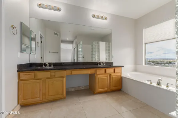 a bathroom with a shower and a sink