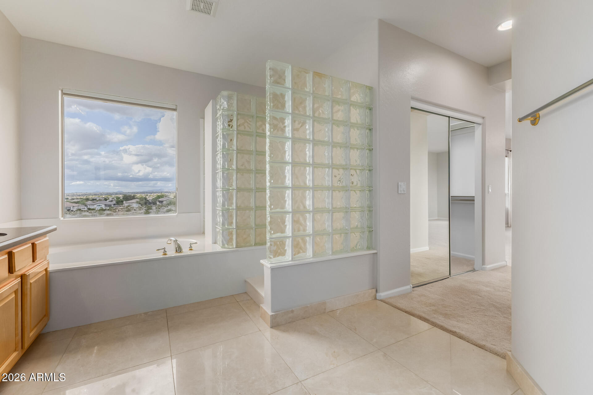 10872 East Raintree Drive Scottsdale, AZ 85255 - Photo 31 of 54 a bathroom with a bathtub and a shower