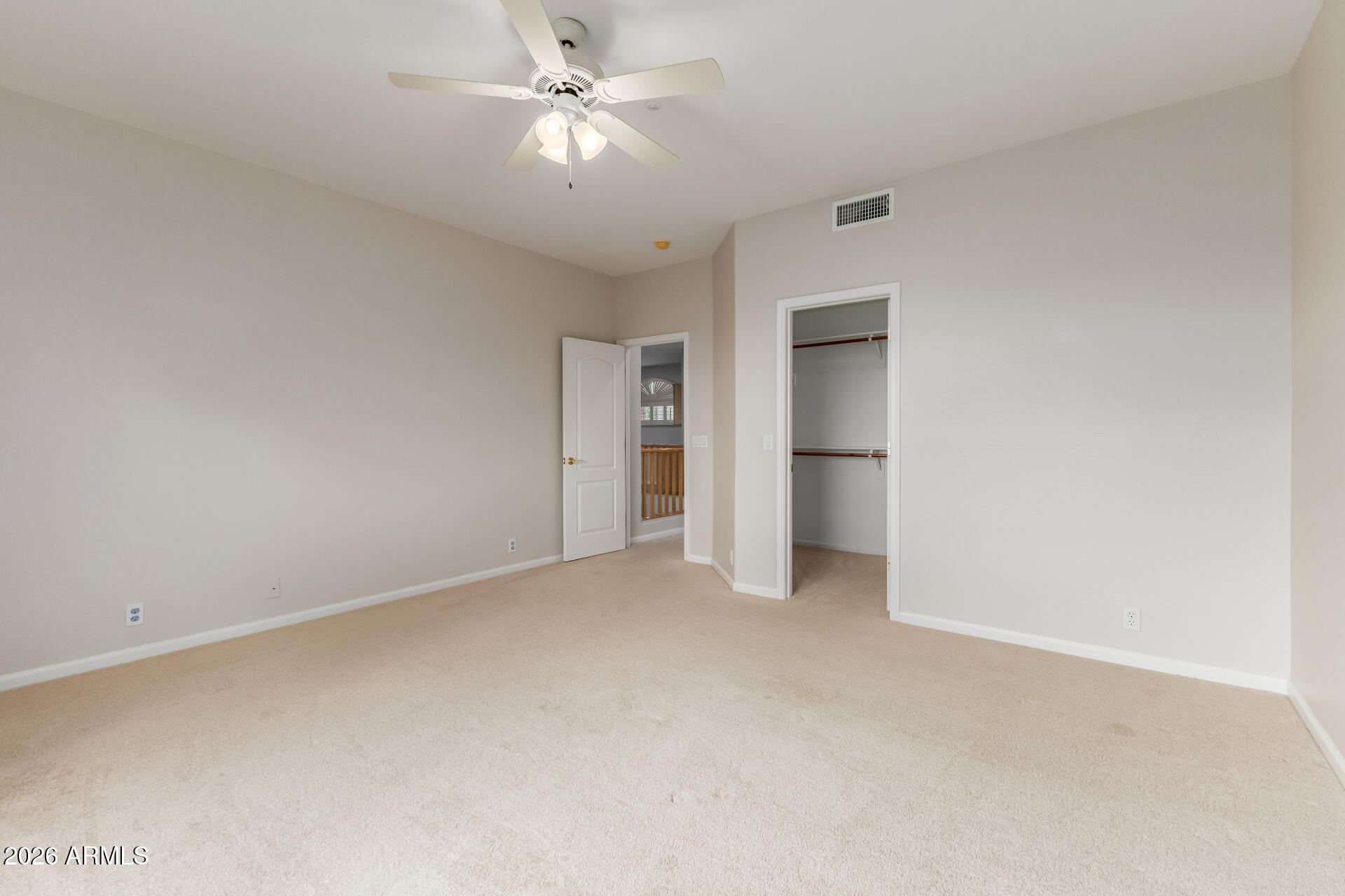 10872 East Raintree Drive Scottsdale, AZ 85255 - Photo 37 of 54 a view of an empty room with a ceiling fan