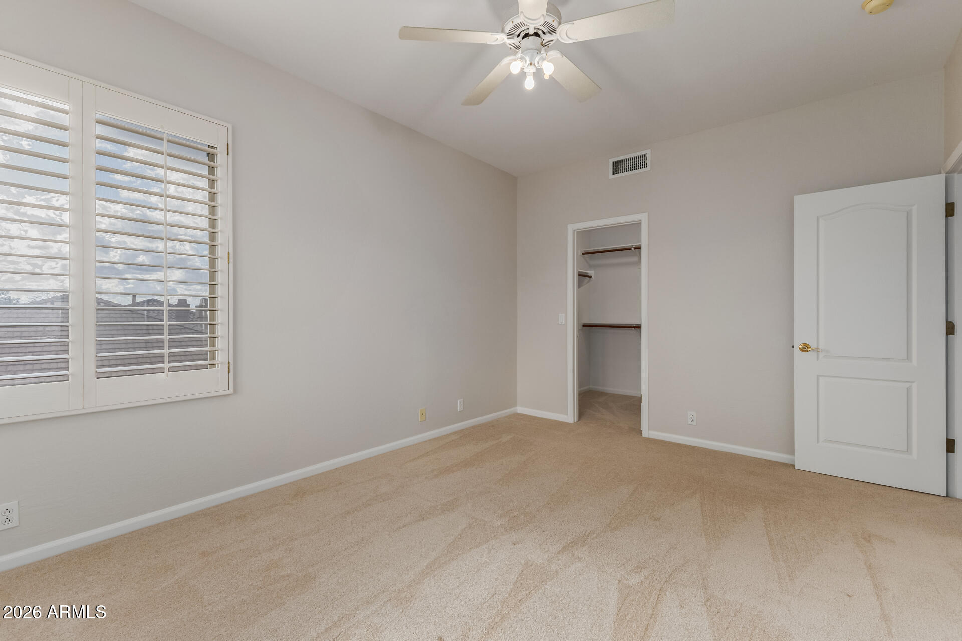 10872 East Raintree Drive Scottsdale, AZ 85255 - Photo 40 of 54 a view of an empty room with a window