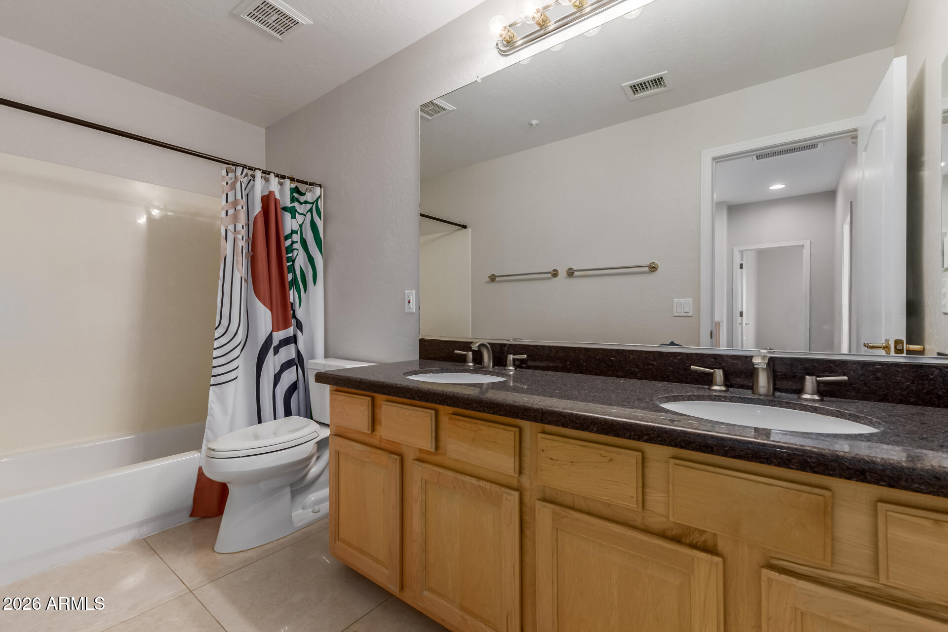 10872 East Raintree Drive Scottsdale, AZ 85255 - Photo 42 of 54 a bathroom with a granite countertop sink a toilet a mirror and shower