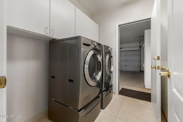 a view of a living room and chandelier