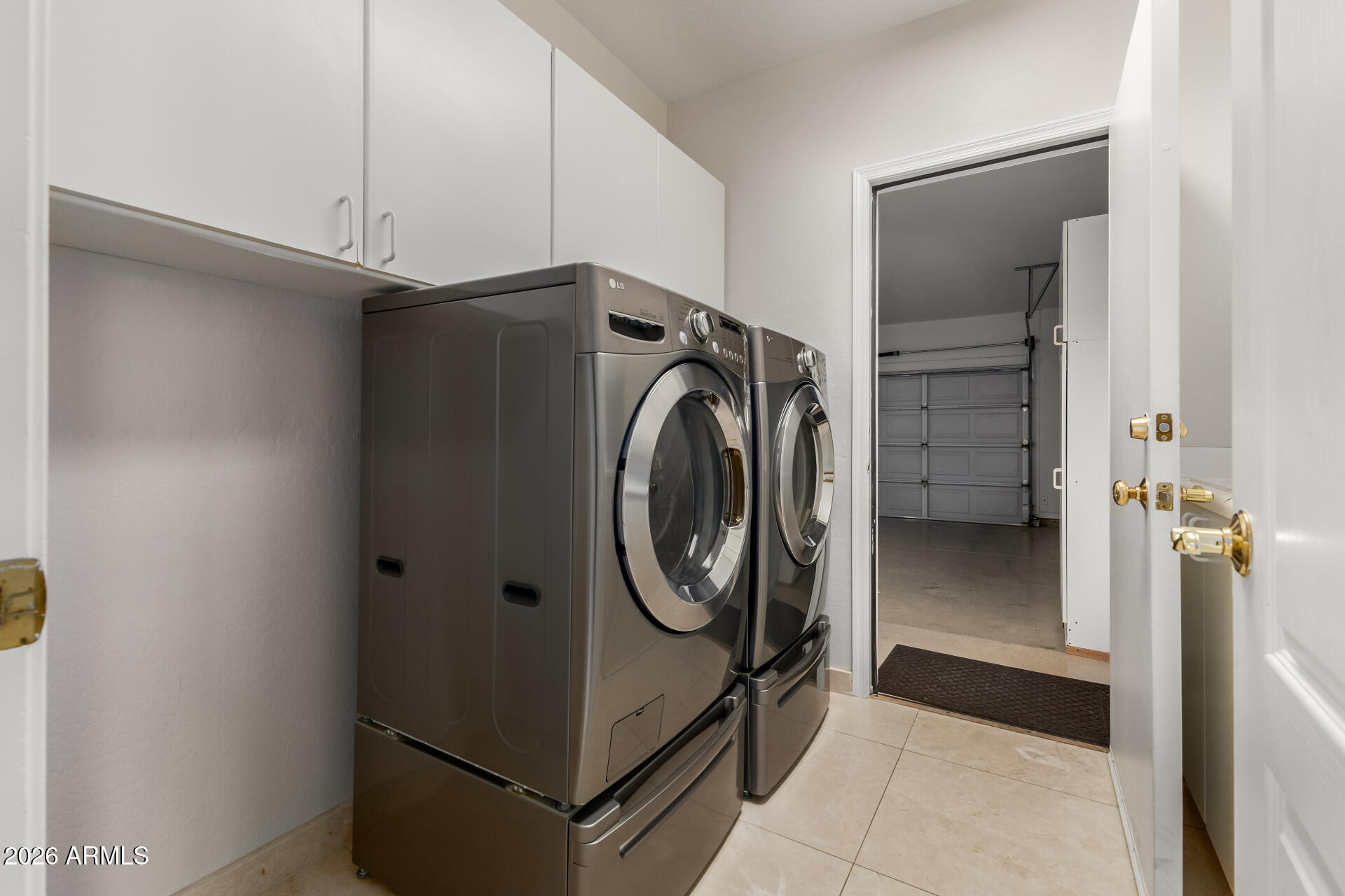 10872 East Raintree Drive Scottsdale, AZ 85255 - Photo 46 of 54 a utility room with cabinets
