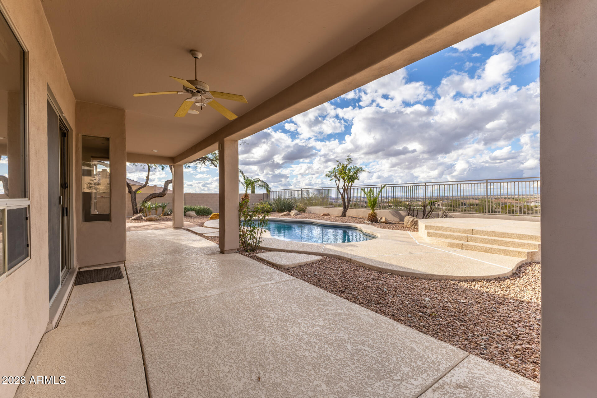 10872 East Raintree Drive Scottsdale, AZ 85255 - Photo 49 of 54 a view of a living room and chandelier