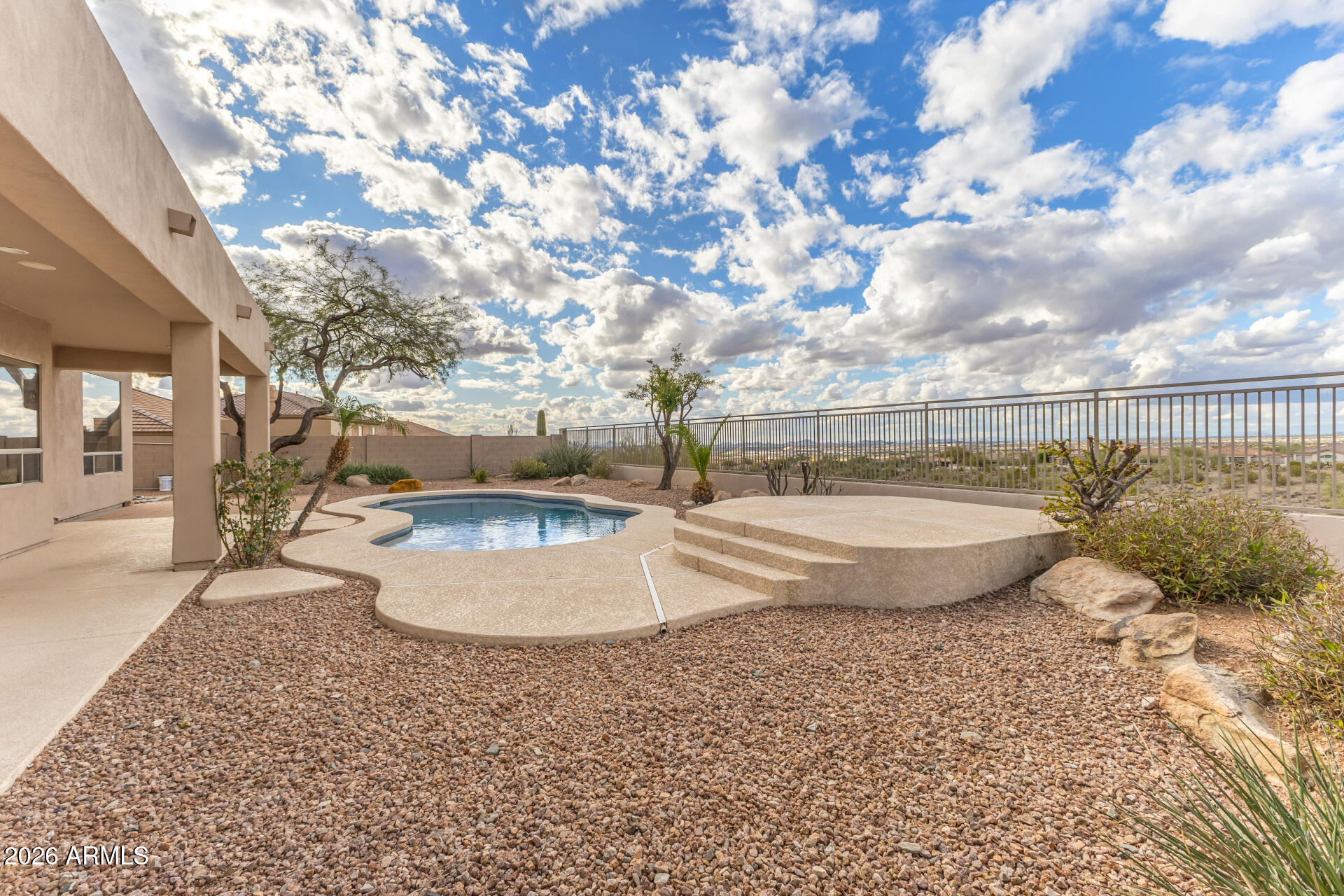 10872 East Raintree Drive Scottsdale, AZ 85255 - Photo 50 of 54 a view of a swimming pool with a yard