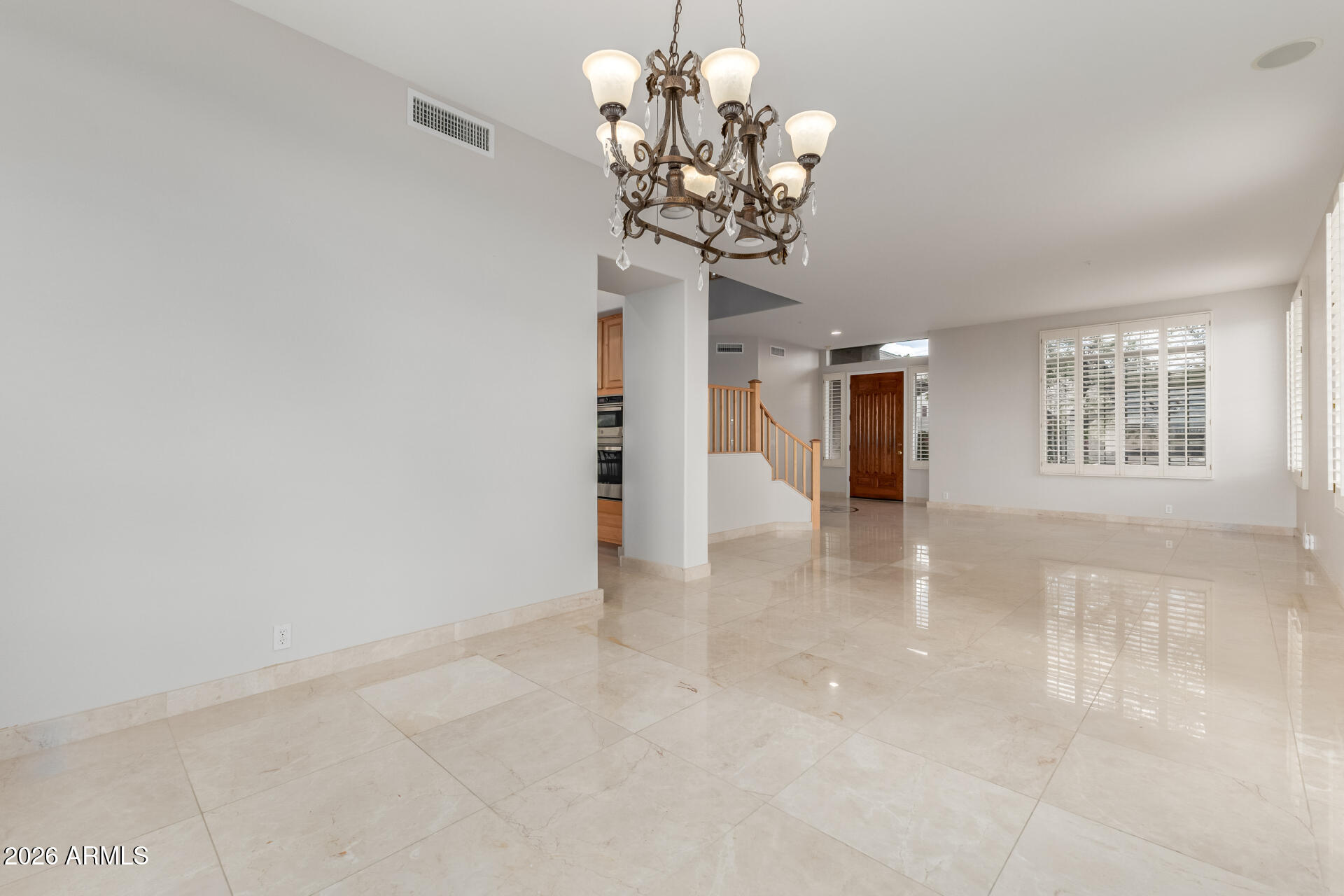 10872 East Raintree Drive Scottsdale, AZ 85255 - Photo 10 of 54 a view of a chandelier in a room