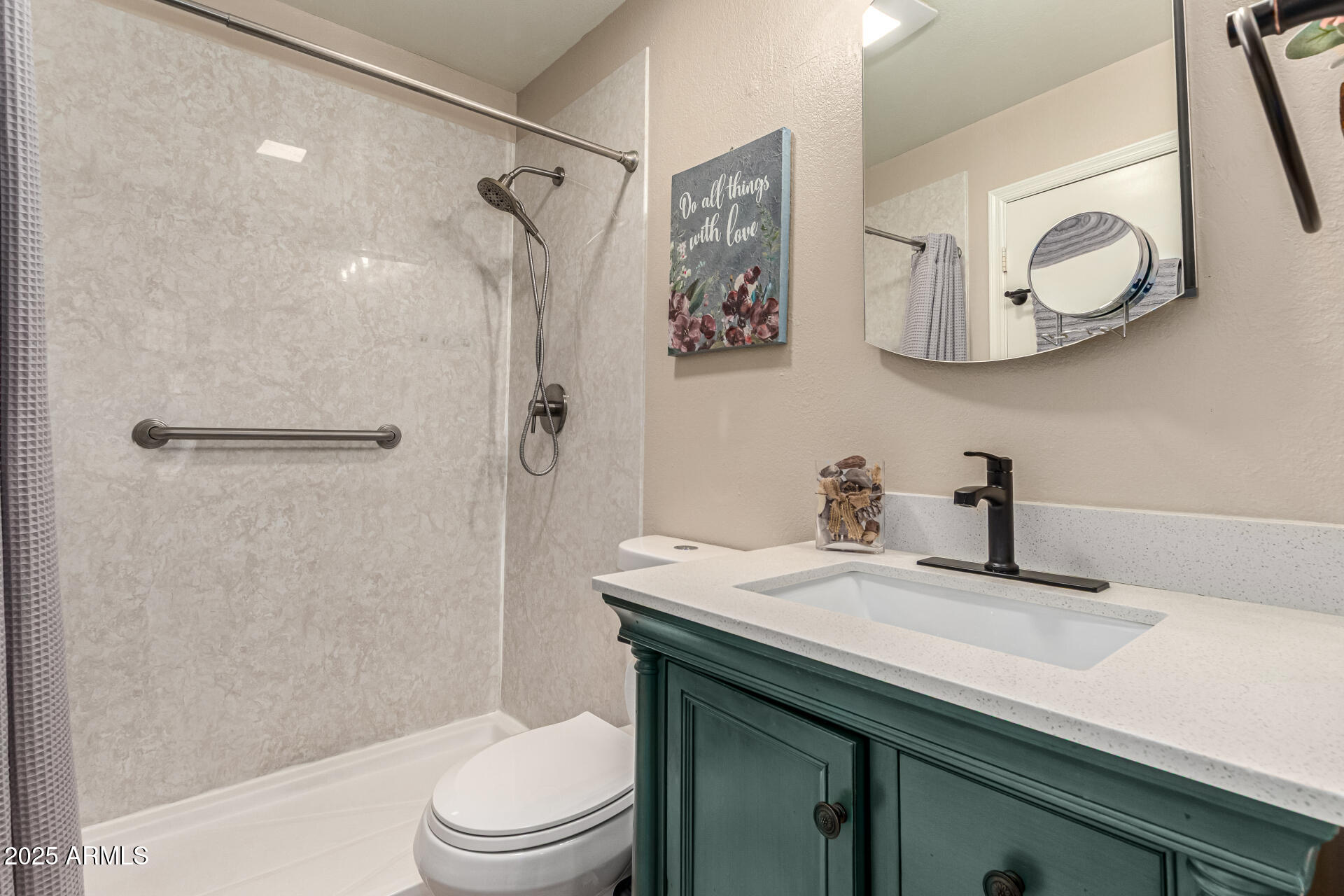 8111 West Wacker Road, Unit 1 Peoria, AZ 85381 - Photo 15 of 26 a bathroom with a sink a toilet and shower