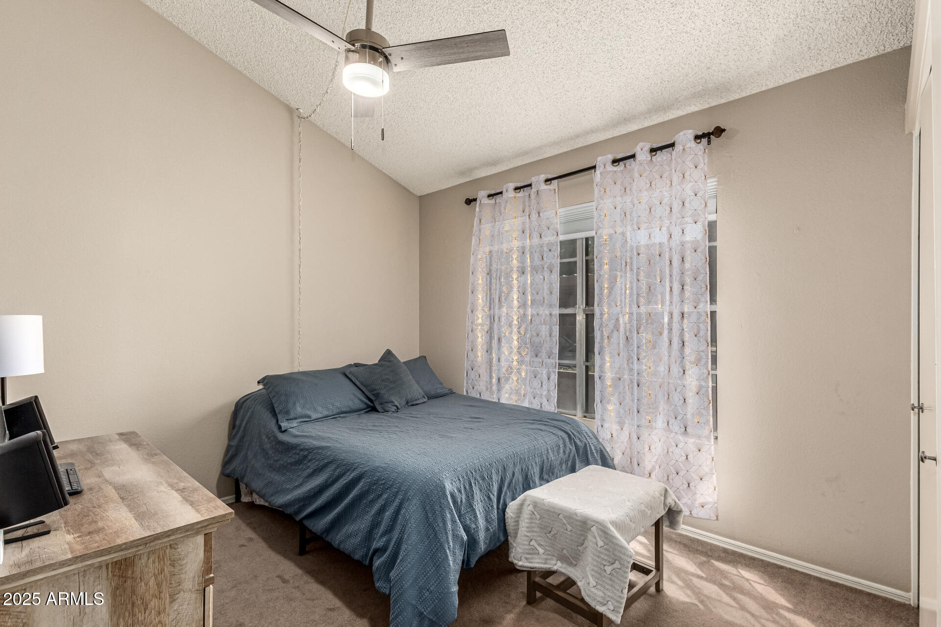 8111 West Wacker Road, Unit 1 Peoria, AZ 85381 - Photo 16 of 26 a bedroom with a bed and wooden floor