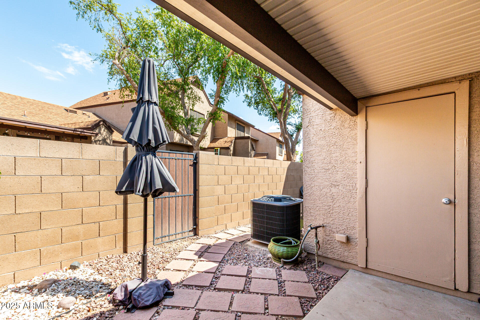 8111 West Wacker Road, Unit 1 Peoria, AZ 85381 - Photo 18 of 26 a backyard of a house with seating space