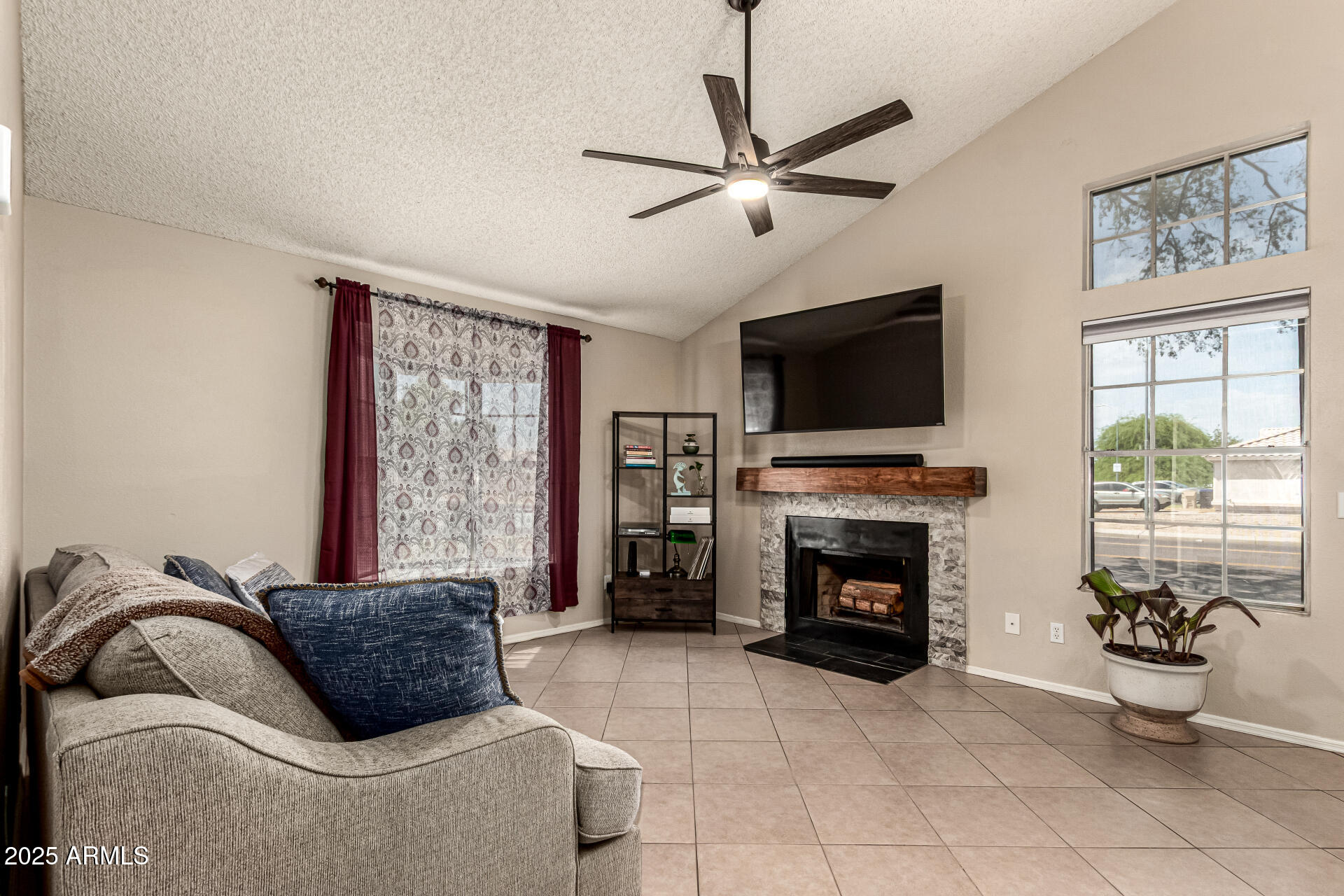 8111 West Wacker Road, Unit 1 Peoria, AZ 85381 - Photo 2 of 26 a bedroom with a bed and a fireplace