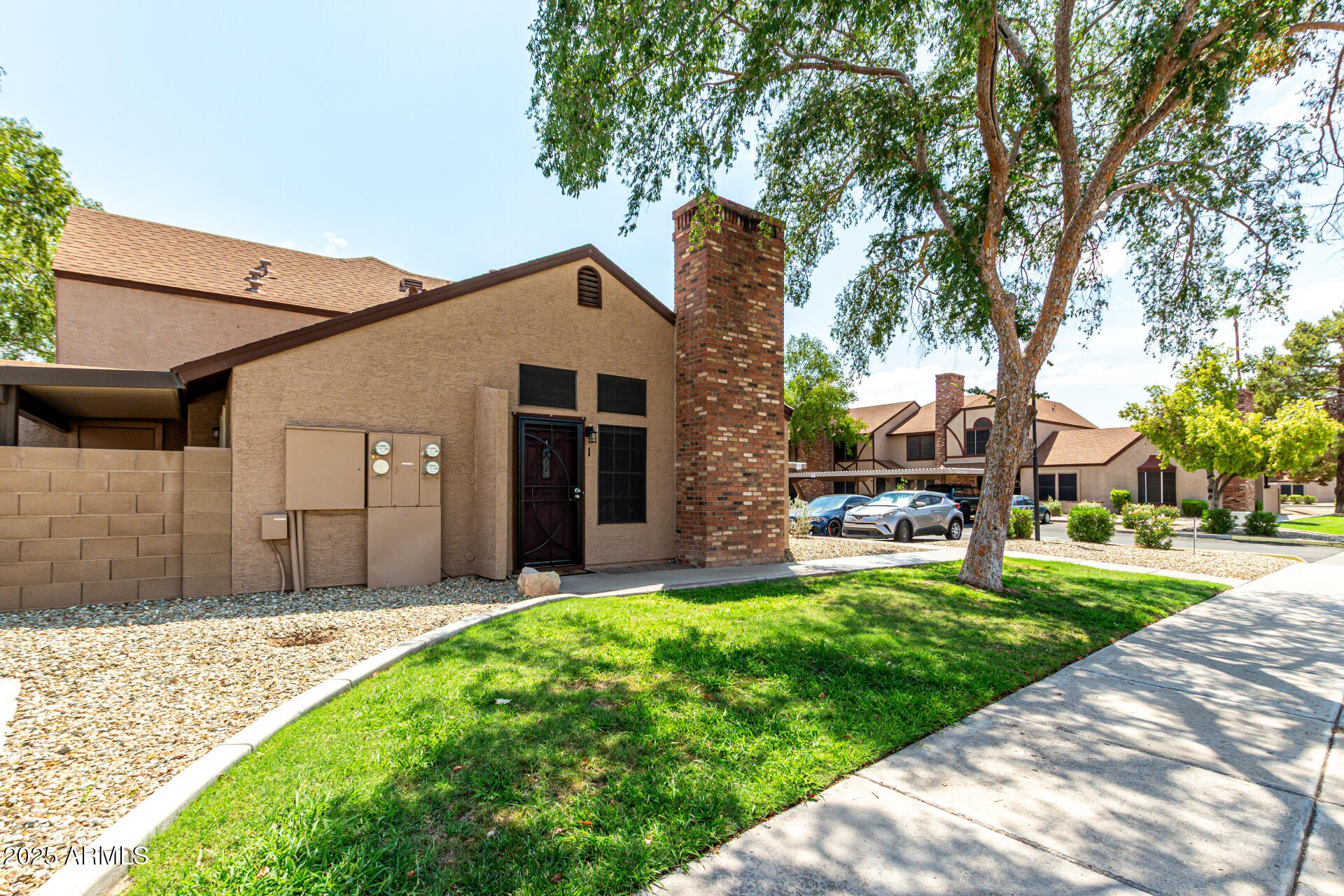 8111 West Wacker Road, Unit 1 Peoria, AZ 85381 - Photo 26 of 26 a front view of a house with a yard and garage