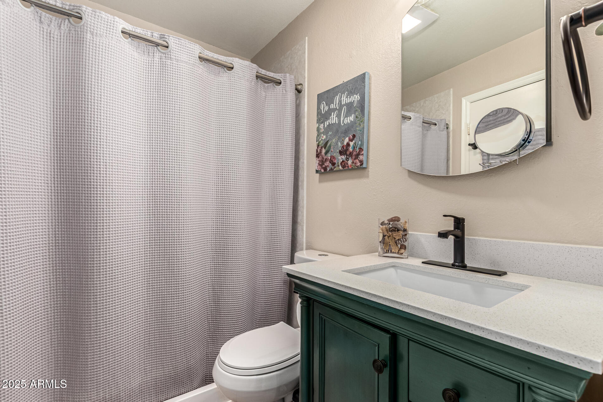 8111 West Wacker Road, Unit 1 Peoria, AZ 85381 - Photo 8 of 26 a bathroom with a granite countertop sink toilet and a mirror