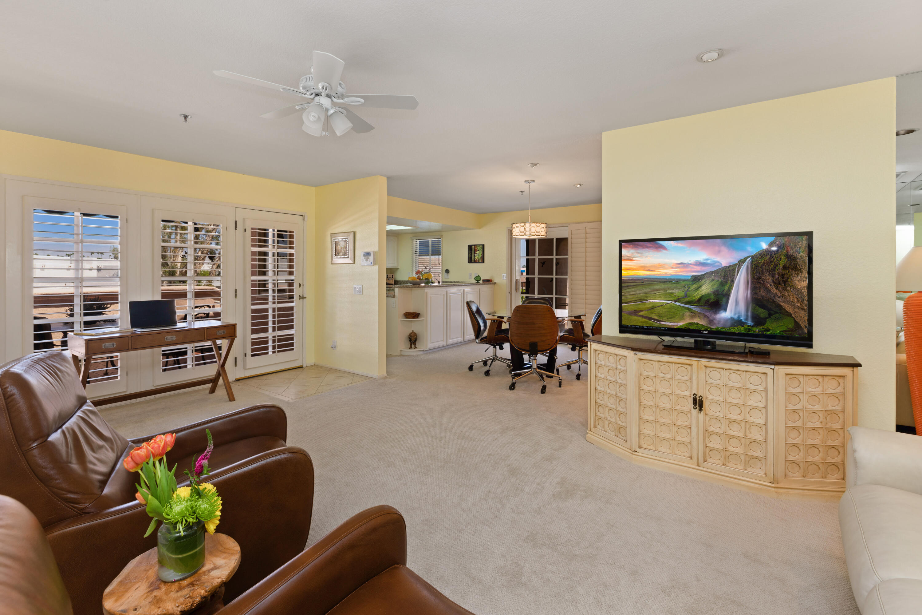 500 East Amado Road, Unit 613 Palm Springs, CA 92262 - Photo 10 of 28 a living room with furniture and a flat screen tv