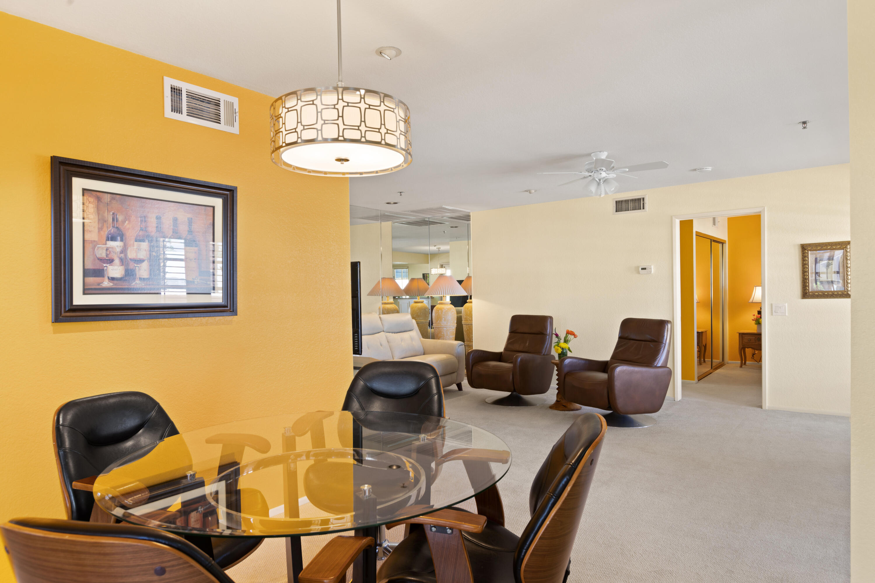 500 East Amado Road, Unit 613 Palm Springs, CA 92262 - Photo 11 of 28 a view of a dining room with furniture