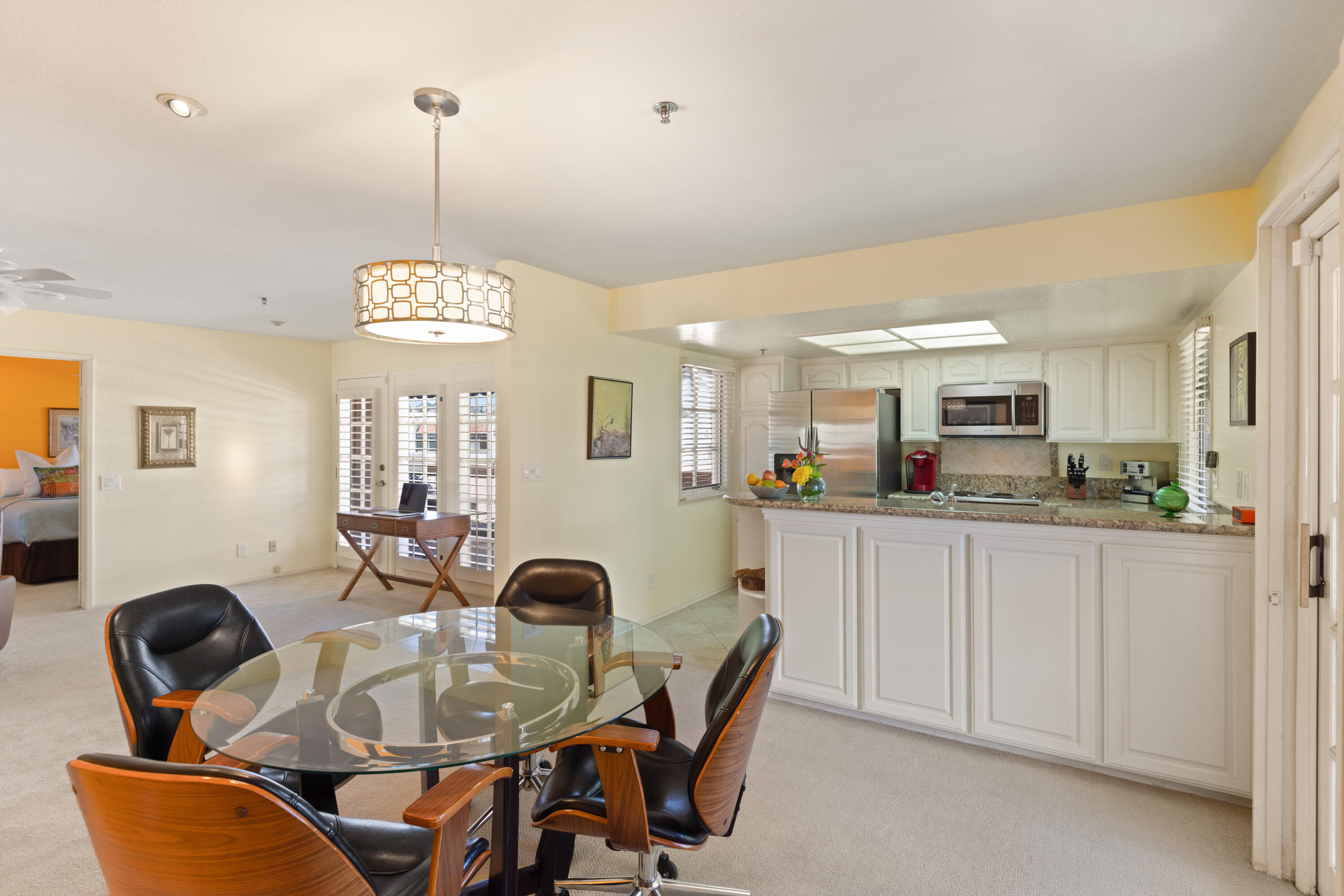 500 East Amado Road, Unit 613 Palm Springs, CA 92262 - Photo 12 of 28 a dining room with furniture and window