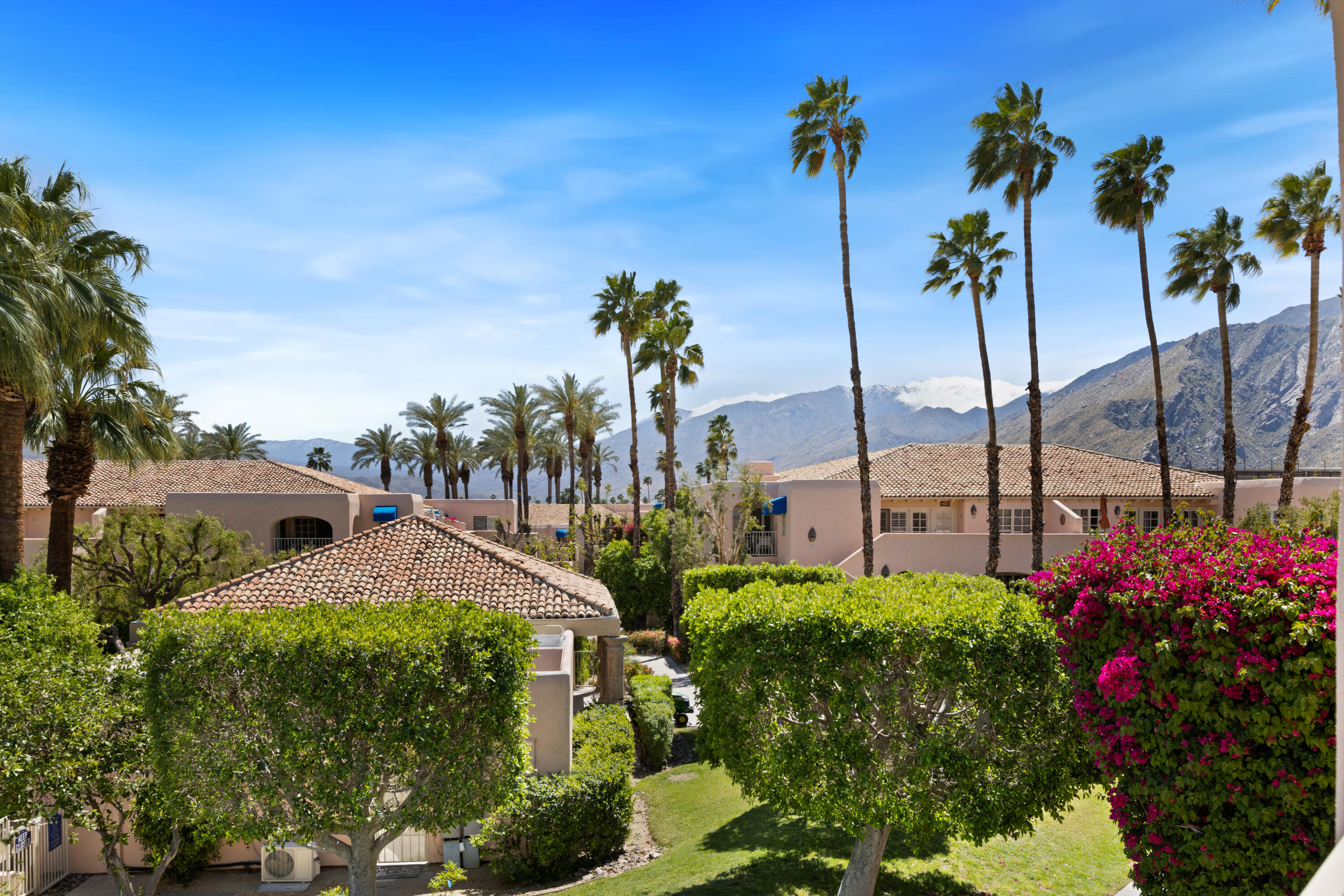 500 East Amado Road, Unit 613 Palm Springs, CA 92262 - Photo 18 of 28 a view of a house with a yard and potted plants