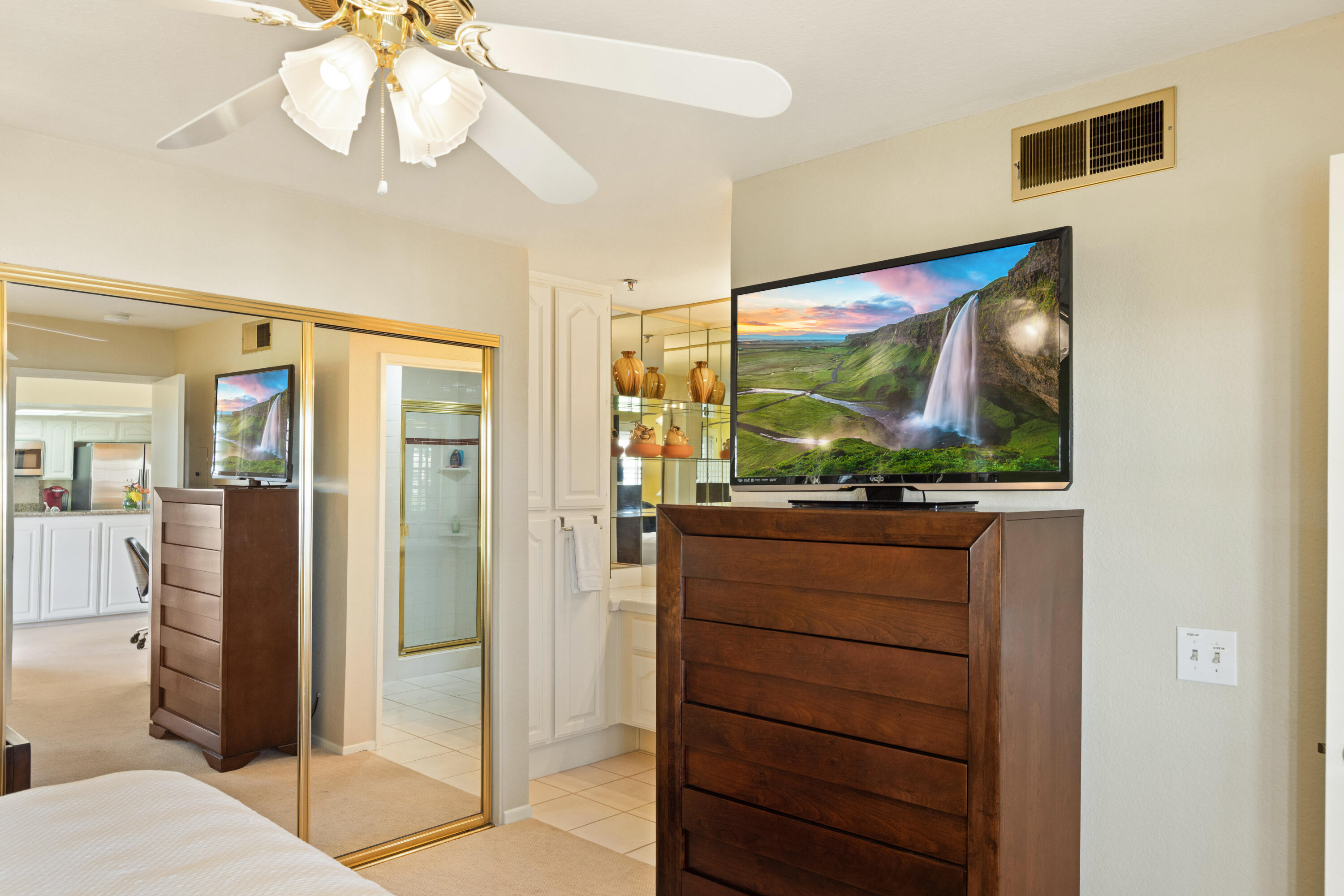500 East Amado Road, Unit 613 Palm Springs, CA 92262 - Photo 20 of 28 a living room with large mirror and furniture
