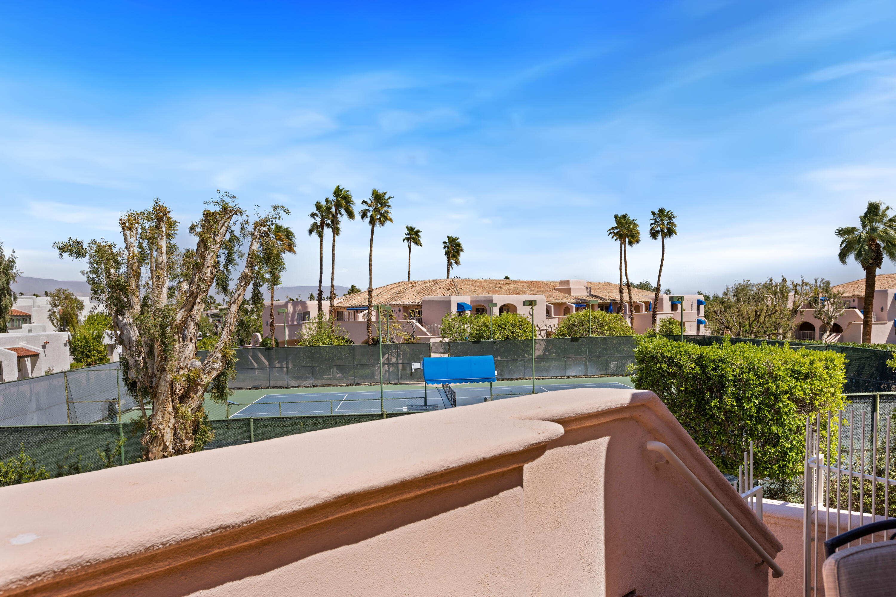 500 East Amado Road, Unit 613 Palm Springs, CA 92262 - Photo 23 of 28 a view of a street with a building in the background