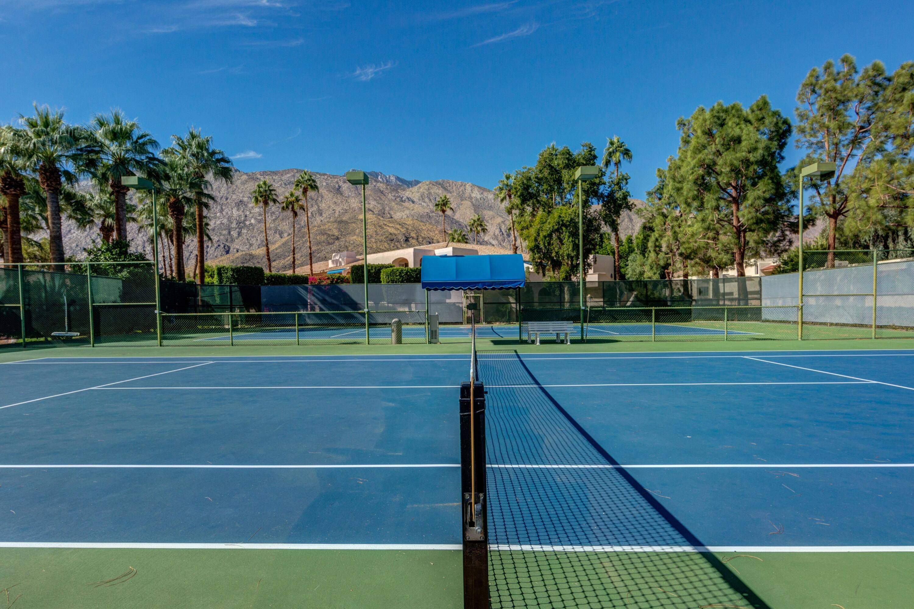 500 East Amado Road, Unit 613 Palm Springs, CA 92262 - Photo 24 of 28 a view of a tennis court