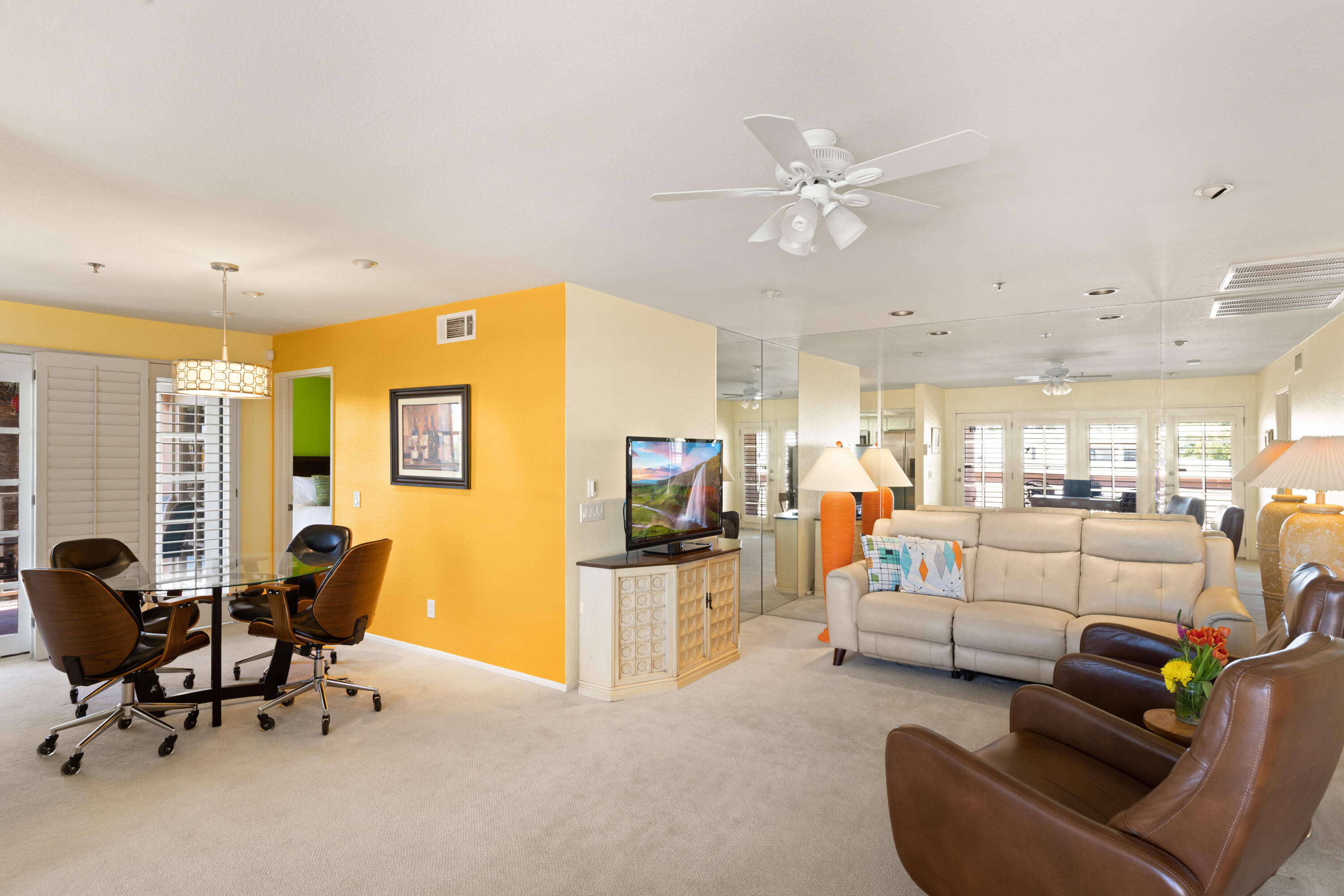 500 East Amado Road, Unit 613 Palm Springs, CA 92262 - Photo 5 of 28 a living room with furniture and a flat screen tv