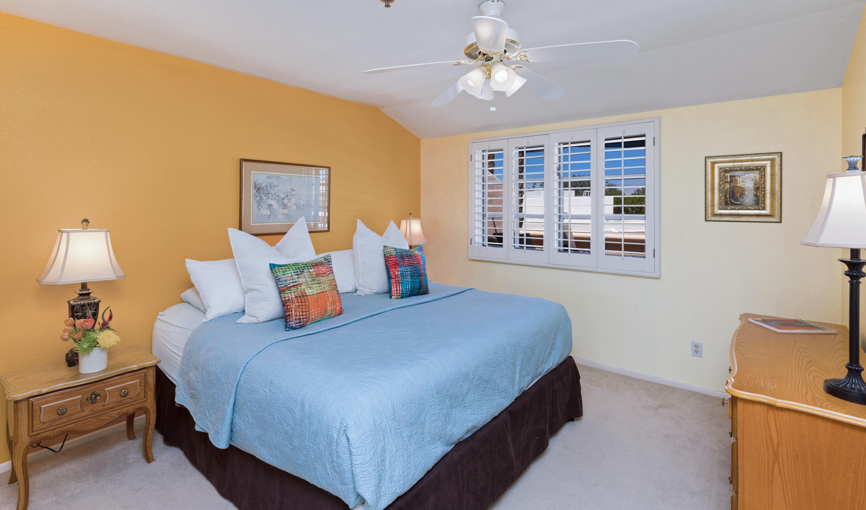 500 East Amado Road, Unit 613 Palm Springs, CA 92262 - Photo 6 of 28 a bedroom with a bed and a chandelier