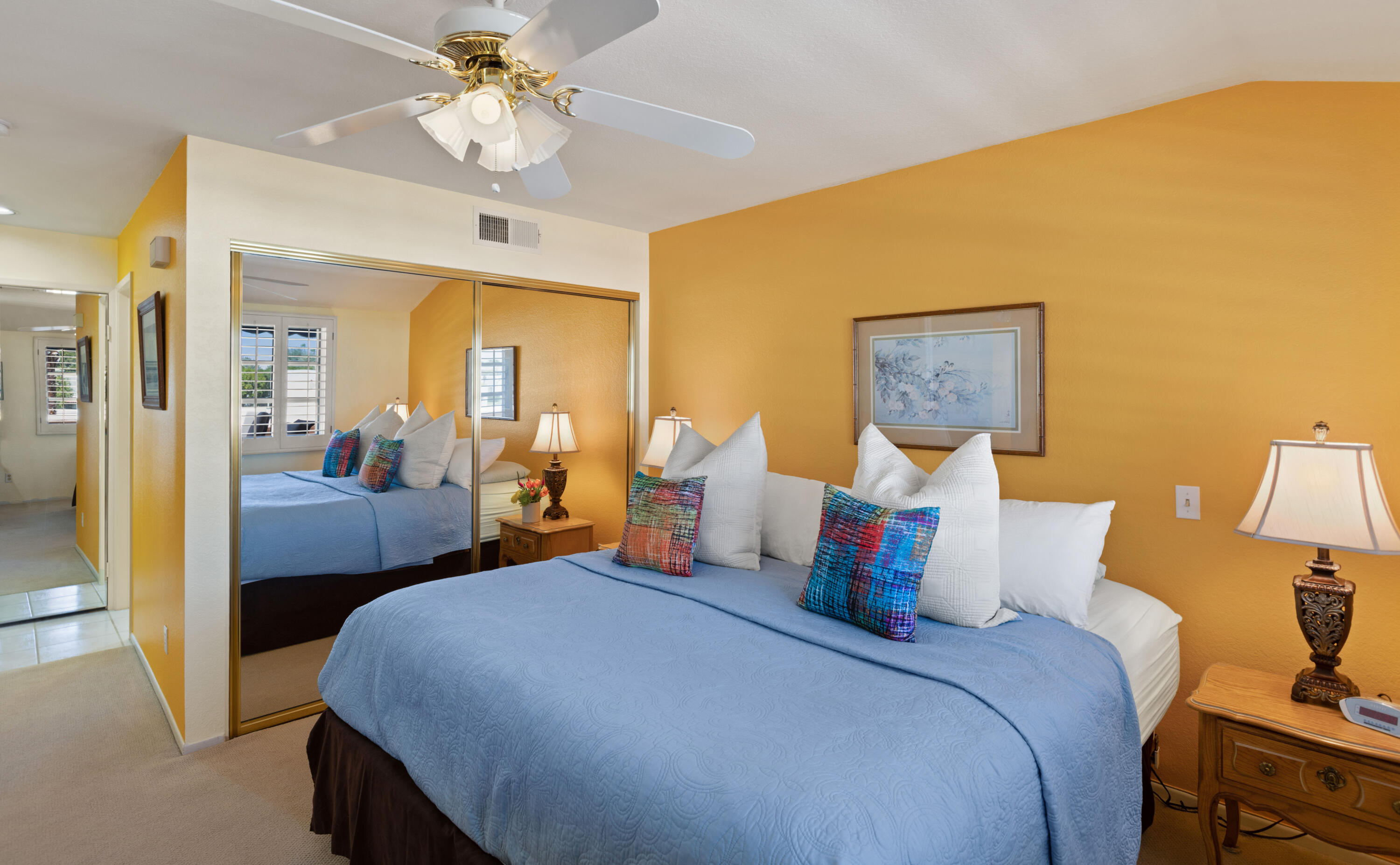 500 East Amado Road, Unit 613 Palm Springs, CA 92262 - Photo 7 of 28 a bedroom with a bed and a chandelier