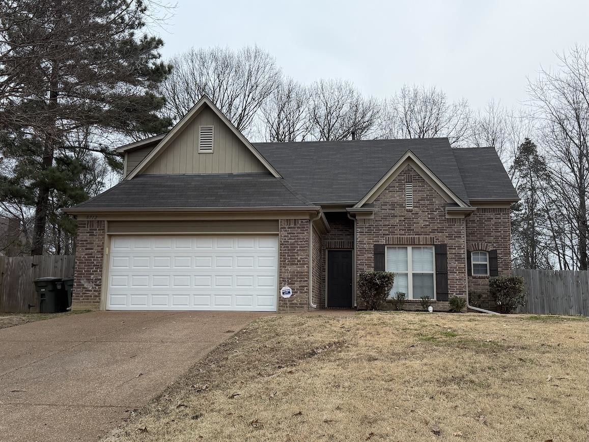 8712 Edney Ridge Drive Cordova, TN 38016 - Photo 1 of 18 a front view of a house with a yard and garage
